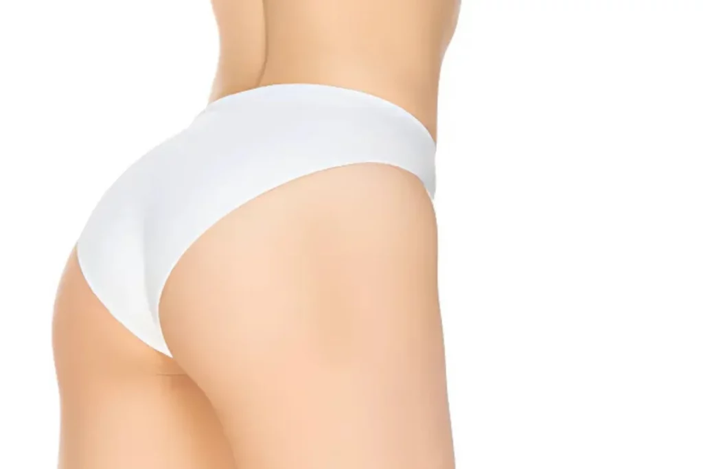 Woman in white bikini bottom, side view