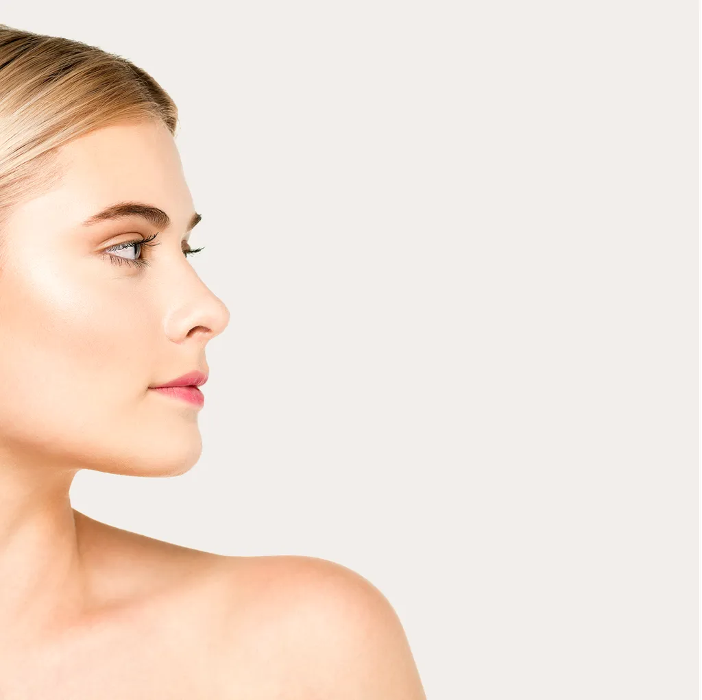 Profile of woman with clear skin and blonde hair.