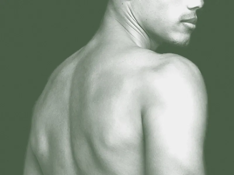 Monochrome image of man's back and shoulder