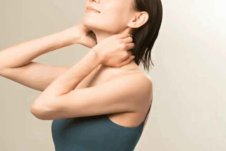 Woman stretching neck in blue top
