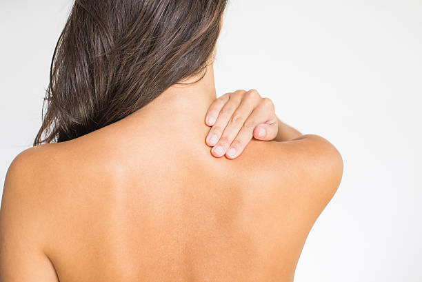 Woman touching back, shoulder pain concept