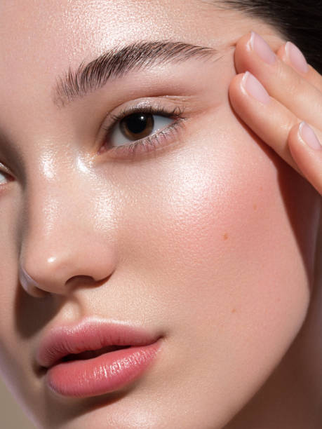 Close-up of woman touching her face